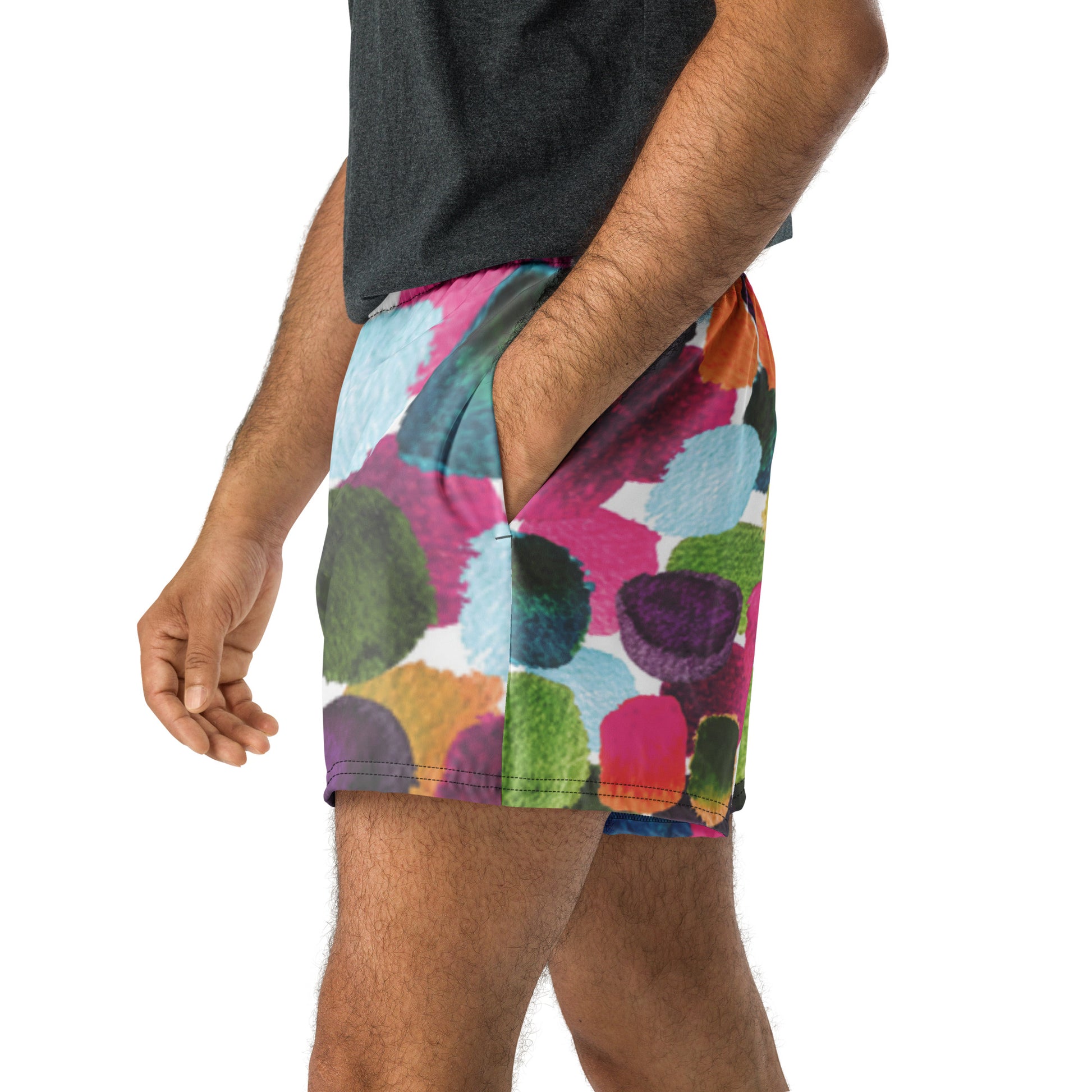 Colorful patterned shorts worn by a person on a white background