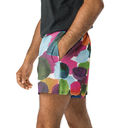 Colorful patterned shorts worn by a person on a white background
